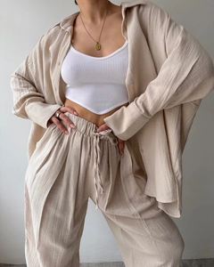 Detailed texture of oatmeal long sleeve linen shirt and high waist wide leg trousers set