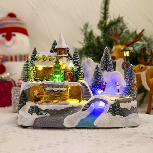 Christmas musical snow house with colorful LED lights and miniature festive figures