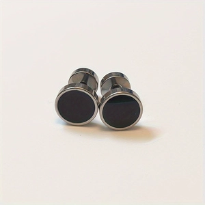 Detail of 8mm round stainless steel stud earrings with black enamel and silver borders