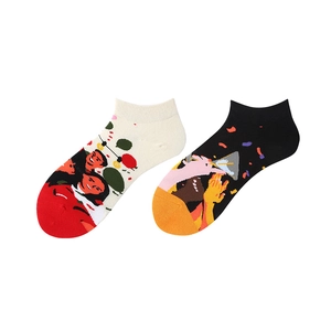 Close-up of abstract pop art patterns on cotton blend ankle socks with ribbed cuffs
