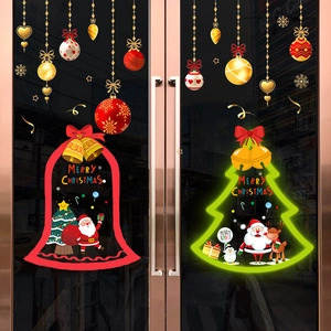 Christmas PVC static window decals featuring Santa and tree on glass shop door