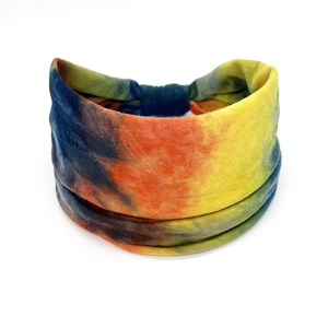 Close-up of bohemian tie-dye elastic cotton sports headband with colorful patterns