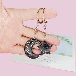 Star and moon acrylic keychain set with gold foil glitter and gold metallic ring