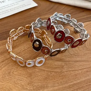 Bohemian enamel elastic bracelets with irregular colorful vintage patterns on wood
