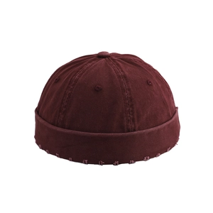 Solid burgundy cotton docker cap with twill texture and six-panel stitching design