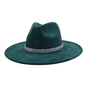 Detailed close-up of dark green suede fedora hat with sparkling silver crystal hatband