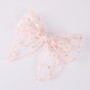 Pink tulle bow hair clip for girls with embroidered white and gold daisy patterns