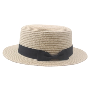 Classic straw boater hat for women with black grosgrain ribbon and bow on white background
