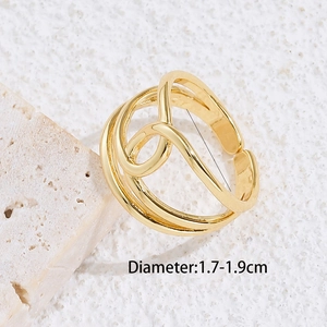 Minimalist 18K gold plated geometric open ring displayed on textured stone