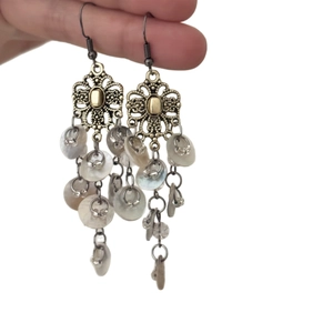 Vintage gold hollow flower earrings with white shell tassels in ethnic style for women