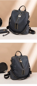 Detail view of black backpack with gray geometric patterns and gold zipper accents