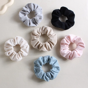 Close-up of 6-piece vintage waffle fabric scrunchie set in assorted pastel colors