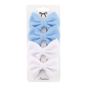 Detail view of 4-piece set featuring blue and white textured fabric bow clips on card