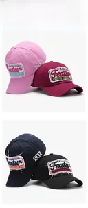 Detailed group display of vintage cotton baseball caps in pink, burgundy, navy, and black
