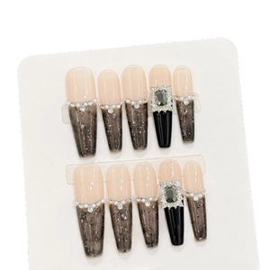 French marble press-on nails with black rhinestones and pearl accents in long style