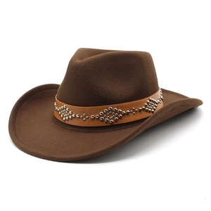 Detail of a brown wool felt cowboy hat featuring a leather band with silver metal rivets