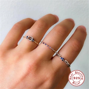 Three-piece set of 925 sterling silver stacking rings with blue and purple zirconia stones