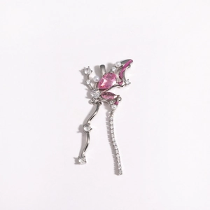 Detail of silver butterfly pendant featuring pink stones, pearls and dangling tassels