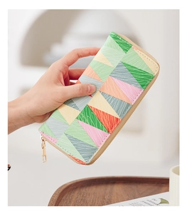 Close-up of geometric printed long wallet with high-quality gold zipper detail