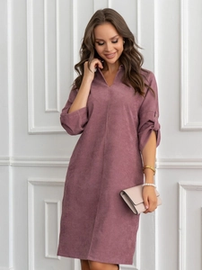 Detail of mauve corduroy dress showing V-neck design and soft ribbed fabric texture
