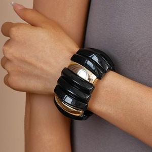 Modern wide elastic bracelet featuring bold black and mirror gold acrylic geometric blocks