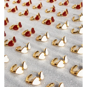 Vintage enamel heart-shaped earrings in red and white with gold-tone metal texture