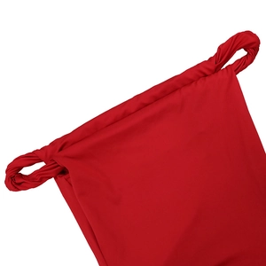 Close-up detail of red off-shoulder dress featuring twisted shoulder strap design