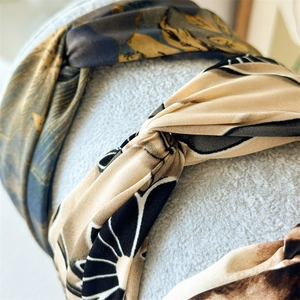 Detail shot of vintage printed fabric headbands with knot design and soft texture