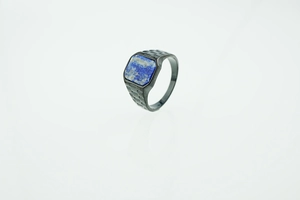 Macro detail of men's square lapis lazuli ring with black grooved stainless steel band