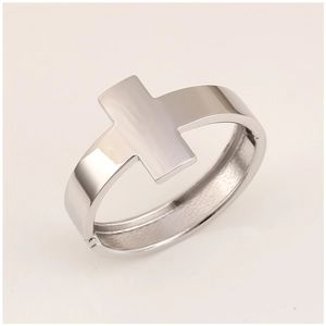 Detailed view of silver cross cuff bracelet with high-polished metallic mirror finish