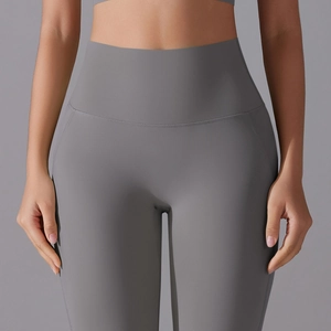 Close-up of seamless high waist waistband on grey yoga shorts for tummy control