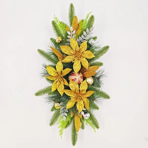 Vertical view of Christmas stair garland with gold flowers and pine needles