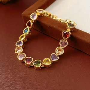 Detail of 18K gold-plated bracelet featuring multicolored heart-shaped gemstones