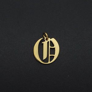 Macro view of gold stainless steel gothic letter O pendant for DIY jewelry making