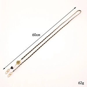 Golden metal chain with black leather braid, camellia flower charm and pearl 60cm length