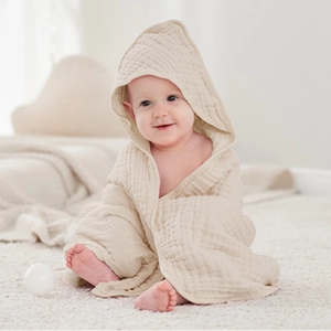 Detail of soft 6-layer muslin cotton baby hooded towel with breathable gauze texture