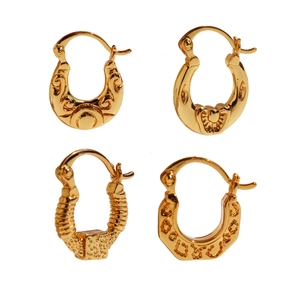 Golden U-shaped hoop earrings featuring vintage embossed floral and textured patterns