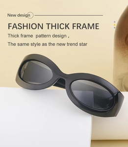 Detail of glossy black thick frame cycling sunglasses with Y2K retro fashion style