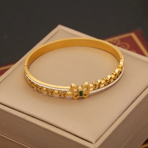 Gold stainless steel butterfly bangle with green gemstone and white zircon stones