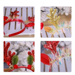 Detailed view of Christmas reindeer antler headband with sequins, bells, and pine needles