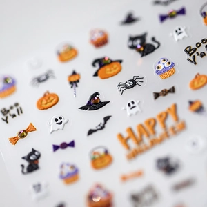 3D Halloween nail stickers with embossed pumpkin, ghost, and rhinestone detail