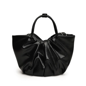 Fashionable black glossy pleated cloud tote bag with elegant curved top handle