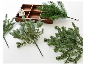 Detailed view of realistic PE pine needles and faux greenery for Christmas wreath DIY decor