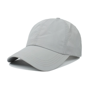 Detail view of the laser-cut breathable mesh and stitching on this grey sports baseball cap