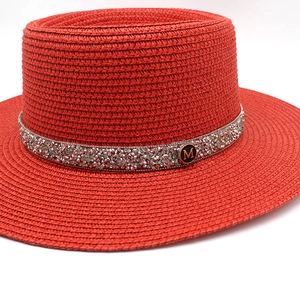 Red candy-colored boater straw hat featuring a sparkling rhinestone M-logo band decoration