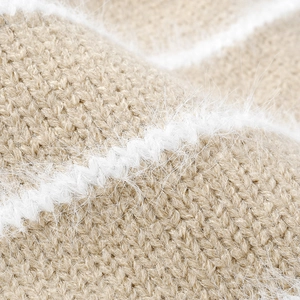Women's color block knit beanie featuring soft mohair texture and thick striped fabric