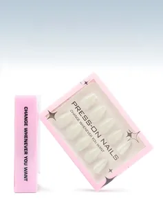 Detail of 30-piece set of almond shape press-on nails in cream white packaging
