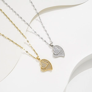 Double heart pendant necklaces in gold and silver with zircon pave on fancy chains