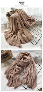 Close-up of dusty pink scarf showing natural crinkle texture and raw frayed edges