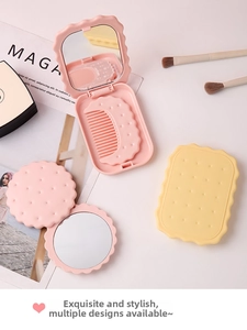 Detail of cute biscuit-shaped folding mirror and comb set in pink and yellow colors